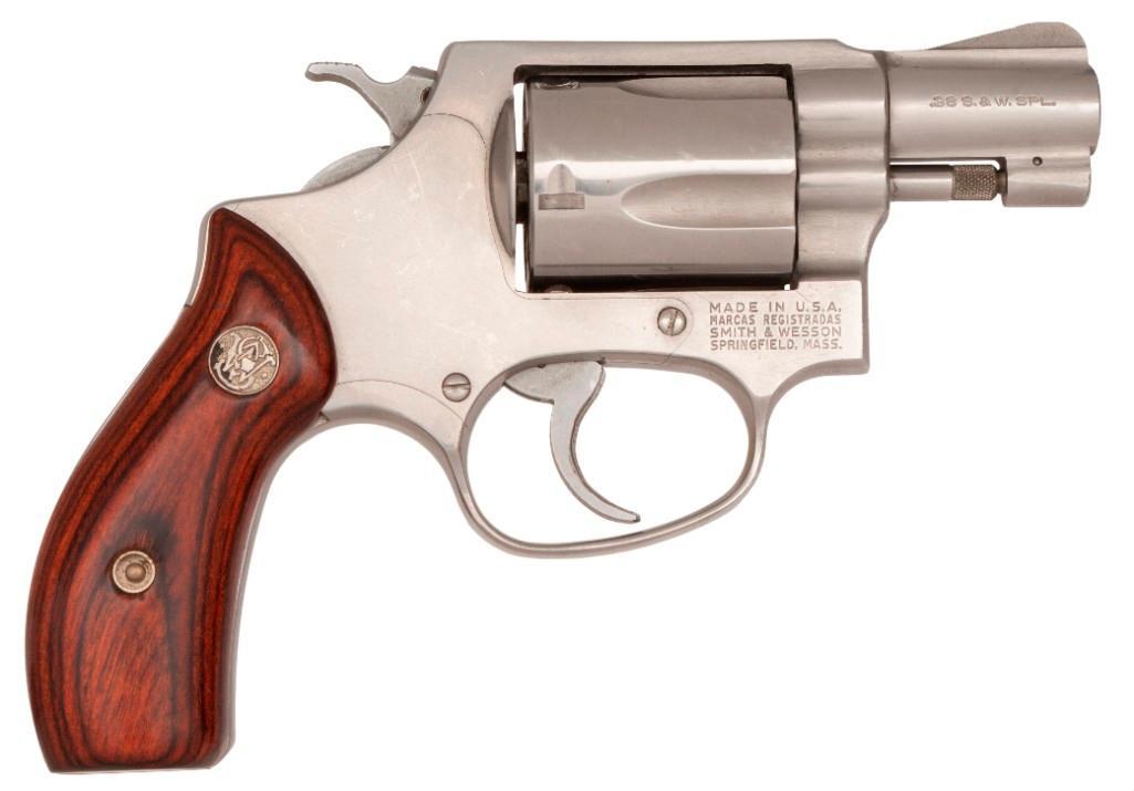 **Smith & Wesson Model 60 Revolver: .38 special, model 60, S/N R321829, 2.5 inch barrel, stainless steel, left barrel single line Smith & Wesson, right barrel single line .38 S.&W. SPL. Overall excellent condition. $400-600