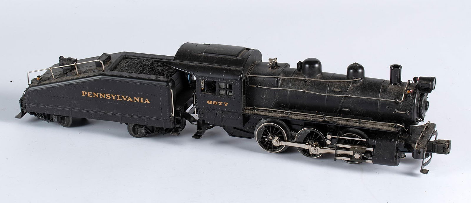 A Lionel Pennsylvania Railway Locomotive with Tender: A Lionel Pennsylvania Railway "railway lines" steam locomotive with tender toy train, number 8977. Overall good condition.