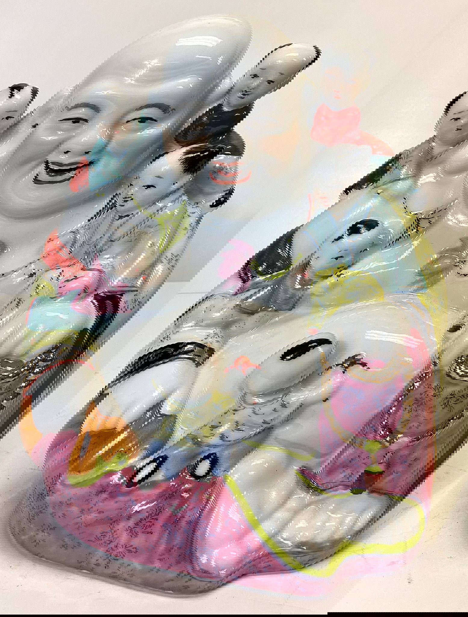 A Chinese Porcelain Buddha With Children Auction