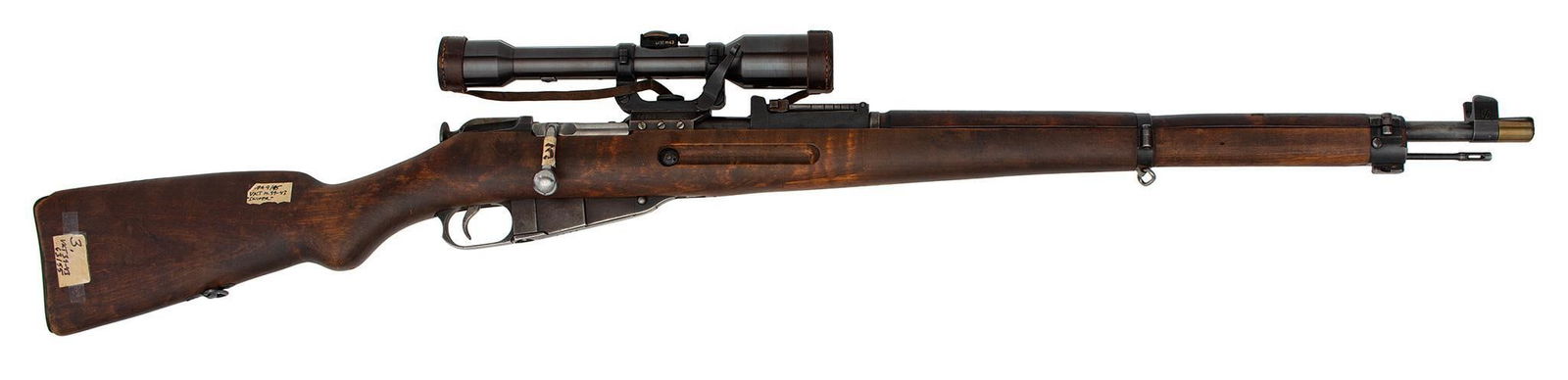 ** A Rare Finnish VKT M39/43 Sniper Rifle: 7.60 X 54R caliber, 28" barrel, S/N 60288, blue finish, with a Finnish scope, Wood stock and handguard. Still retains the original arsenal tags. One of twelve known in the USA. The metal retains nearl