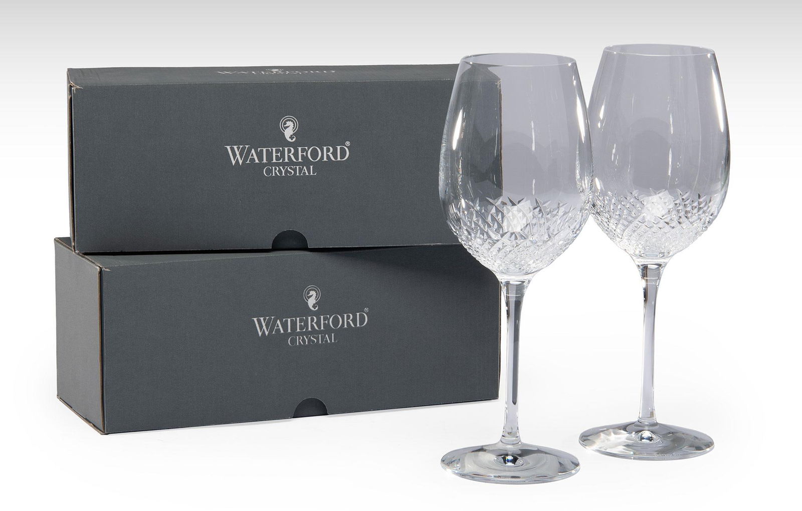 12 Waterford Crystal Alana Essence Red Wine Stemware: American, 20th century. A group of 12 Alana Essence goblets or red wine crystal stemware pieces by Waterford, each in original boxes; ht. 10.75 inches. Overall like new condition.