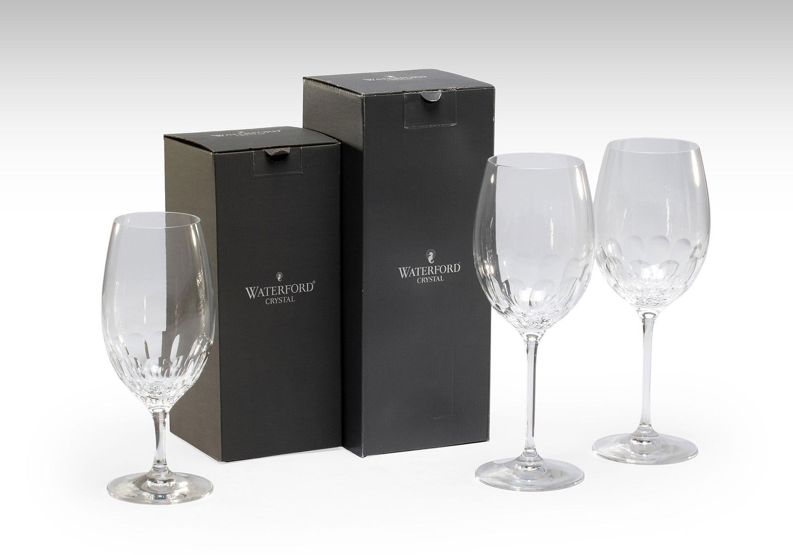 20 Piece Waterford Crystal Crossroads Impression Pattern Stemwares: American, 20th century. A grouping of Waterford crystal stemware pieces in the Crossroads Impression pattern, lot includes 6 white wine, 4 iced beverage, and 10 red wine goblets in original boxes. Ove