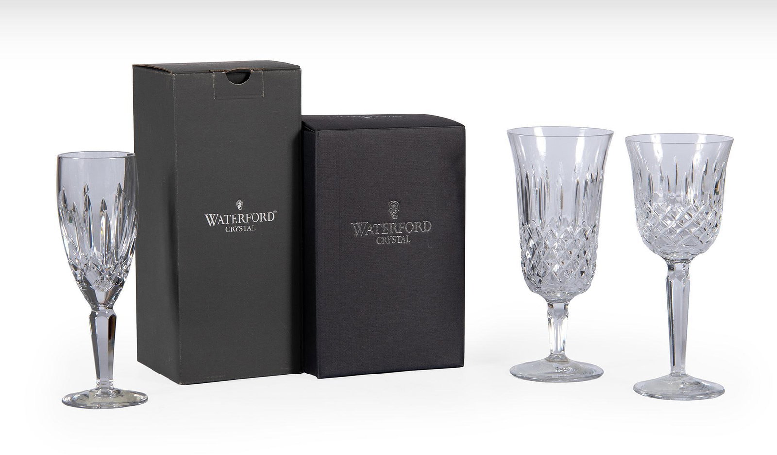 10 Pieces of Waterford Crystal Stemwares: American, 20th century. A group of 10 waterford cystal stemware pieces, lot includes 4 Kildare flute champagnes, a single Lismore Encore white wine glass, and 5 Kelsey iced beverage glasses, all in or
