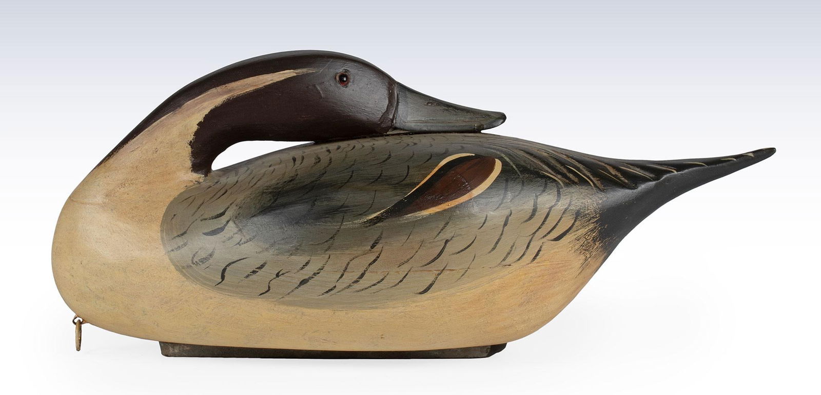 A Carved and Painted Pintail Drake Preening Duck Decoy (1 of 4)