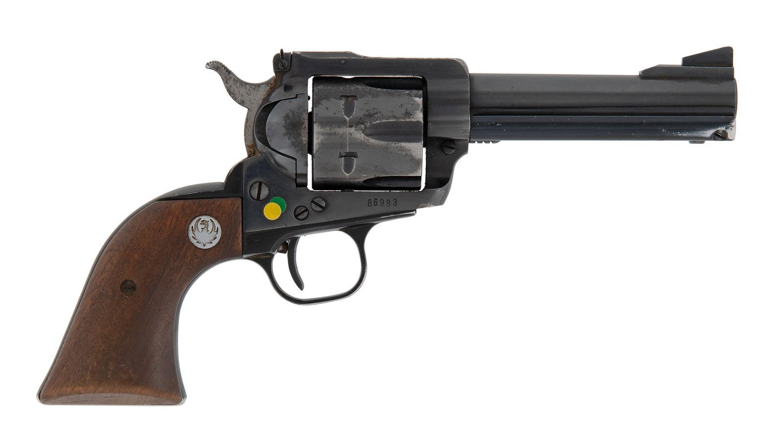 Ruger Blackhawk Revolver: .357 mag caliber, 4.5" barrel, S/N 86983, Blue finish with Walnut grips and Ruger Medallions. Target sights. The revolver retains most of the blue finish. With some wear on the front of the cylinder a