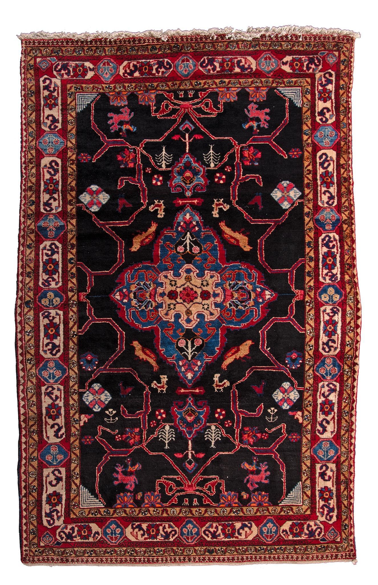 A Navahand Area Rug: Iran, 20th century; 116 x 64 inches. Overall good condition.