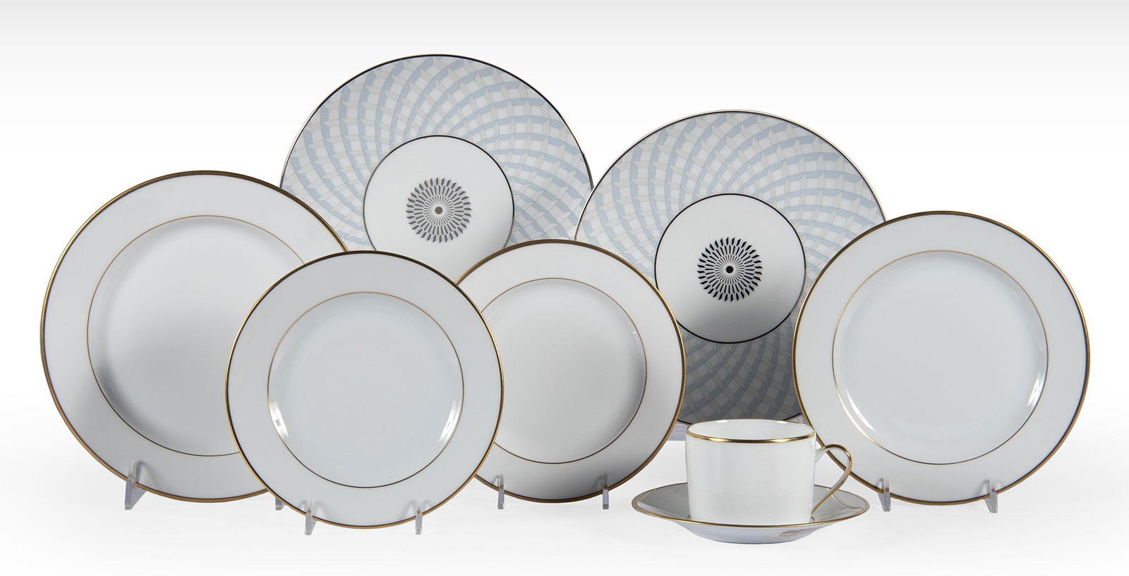 A Group of Bernardaud Porcelain Dinnerwares: French, 20th century. A grouping of Bernardaud porcelain dinnerware plates, lot includes the Palmyre Pattern and Paradise, lot includes two Paradise coupe salad plates & 5 Palmyre plates that include