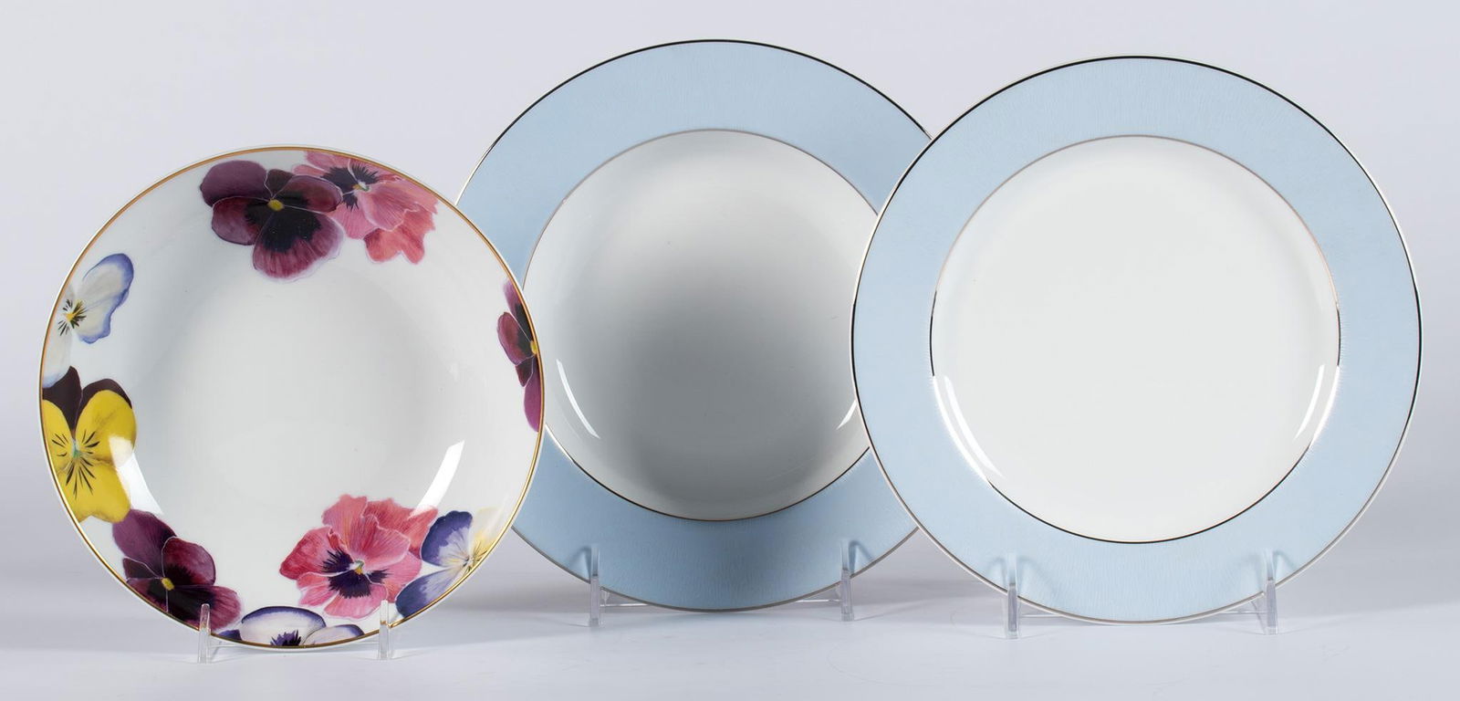 A Group of Bernardaud Porcelain Dinnerwares: French, 20th century. A group of 3 porcelain service pieces by Bernardaud, lot includes dune blea dessert plate and soup bowl, and a single foliate coupe bowl; largest 8.75 inches. Overall good condit