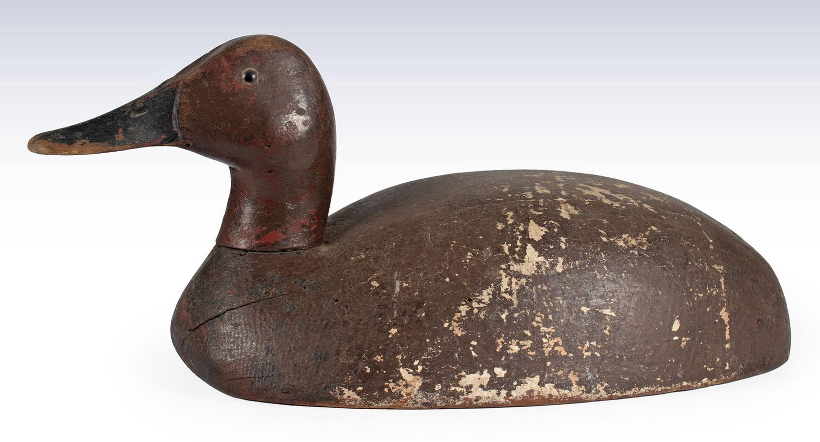 Illinois Duck Decoy: American, 20th century. Illinois painted duck decoy, brownish red body with red head and black bill; ht. 7, wd. 15, dp. 7 inches. Overall good condition.