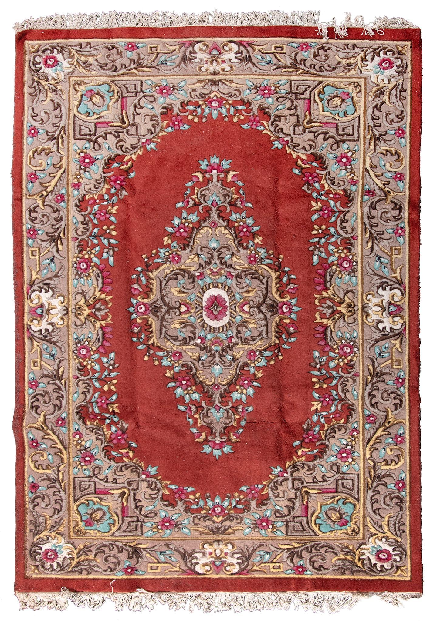 An Aubusson Rug: Aubusson are rug 20th century; 108 x 72 inches. Overall good condition.