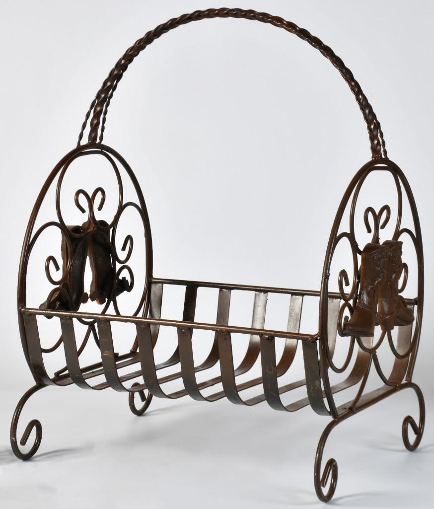 An Iron Wood Rack with Cowboy Boots: American, 20th century. An iron wood rack with twist handle and cowboy boot overall design; ht. 23, wd. 17, dp. 15 inches. **Overall good condition.**