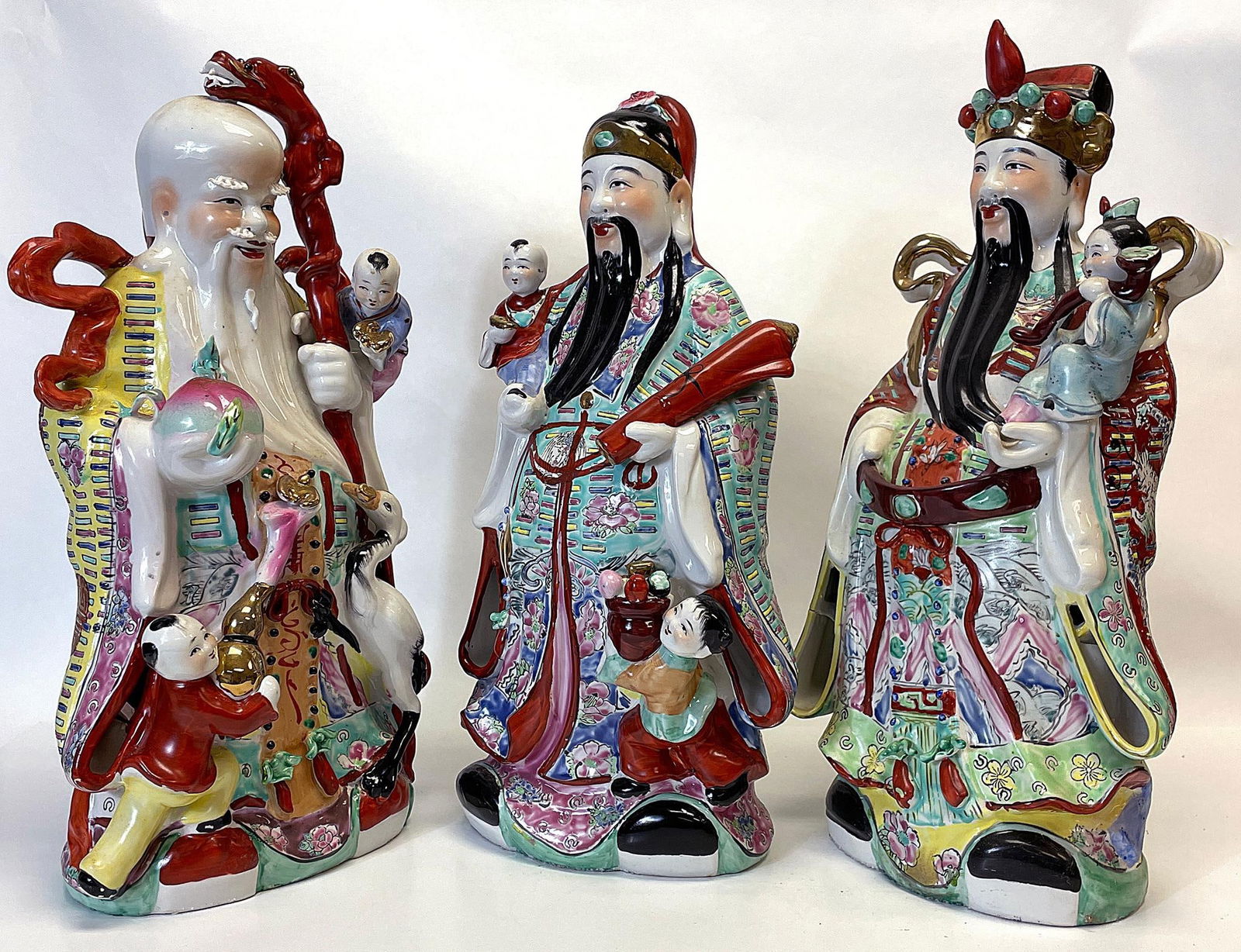 A Group of Three Chinese Polychrome Porcelain Immortal Figures with Children (1 of 5)