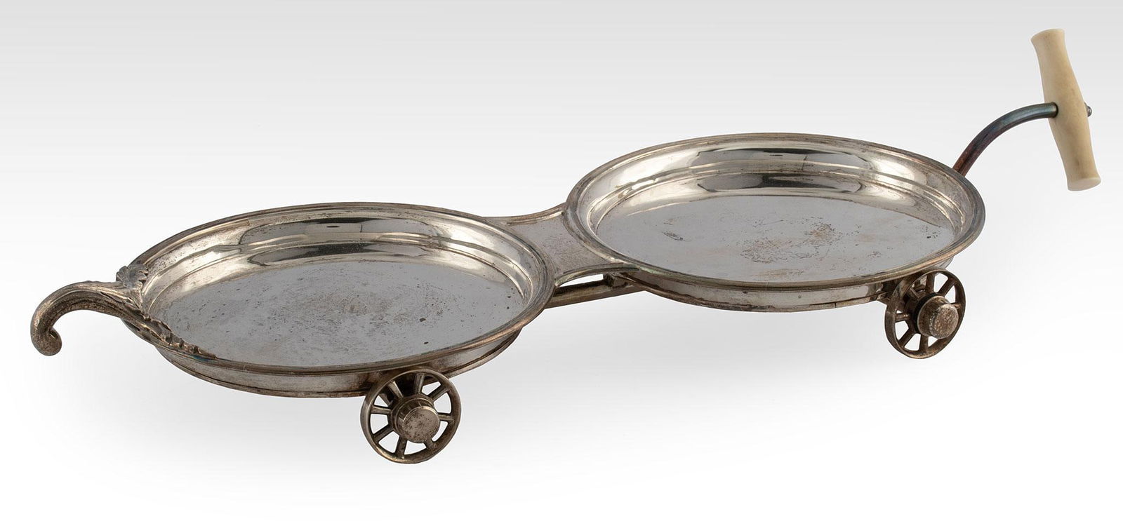 A William IV Silver Decanter Wagon by Robert S. Garrard: English, circa 1836. A William IV silver double wine trolley or decanter wagon made by Robert S. Garrard, double decanter wagon with acanthus leaf design, RS London A letter date (1836) and monarch ha