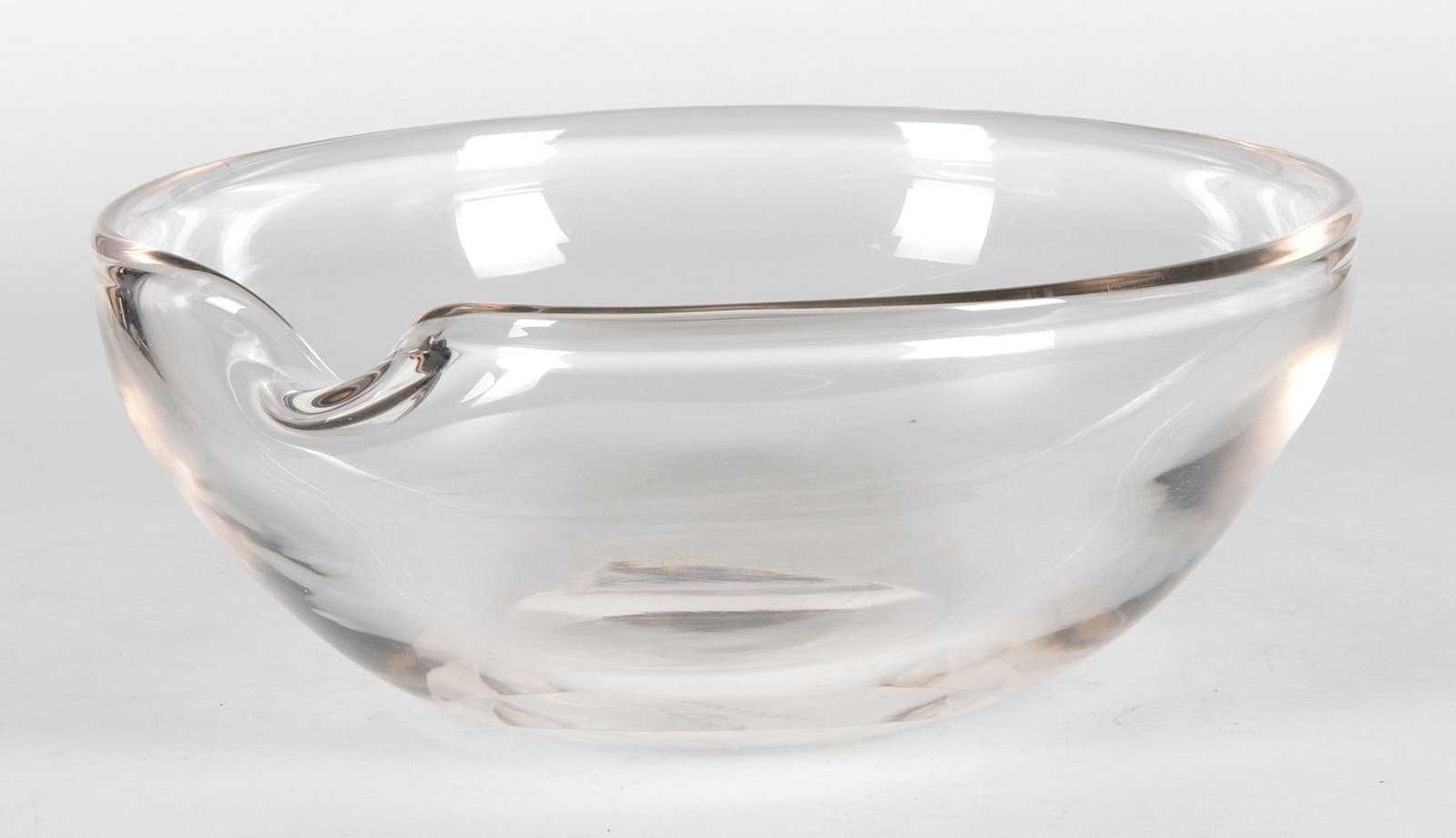 Elsa Peretti for Tiffany & Co. Glass Centerpiece Bowl: American, 20th century. A Venetian glass "Thumbprint" centerpiece bowl by Elsa Peretti for Tiffany & Co. Scratch signature Elsa Peretti for Tiffany & Co. on the underside of base; ht. 