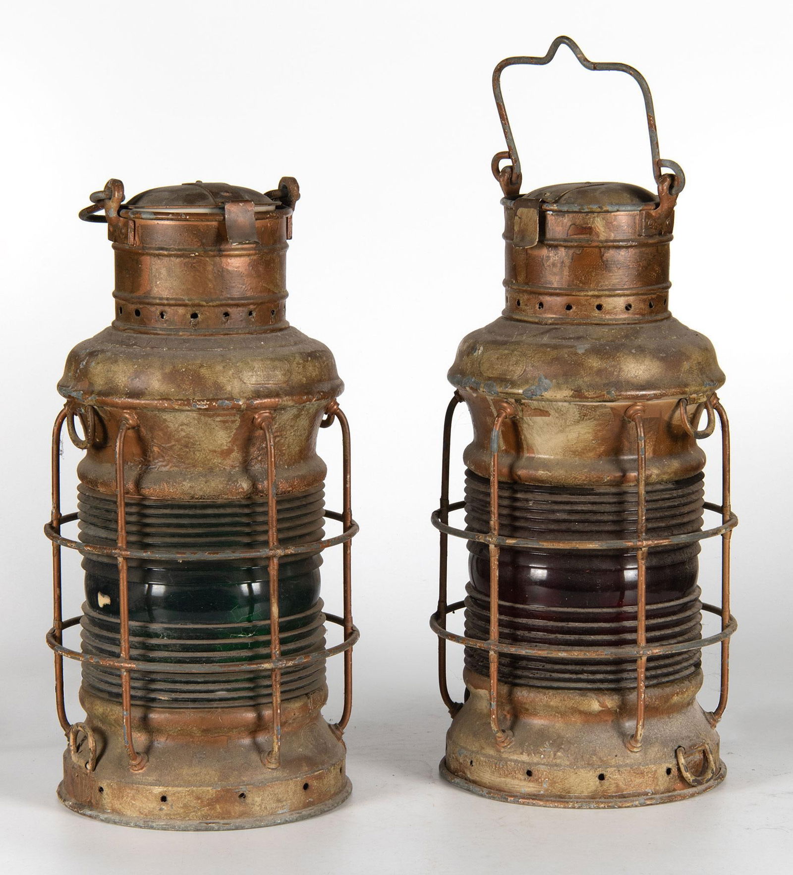 A Pair of Brass Ward & Henrickson Anchor Lanterns: American (New York), early 20th century. A pair of brass anchor lanterns made by Ward & Henrickson, single lantern with cobalt fresnel lens and single with ruby red fresnel lens, each with 360 deg