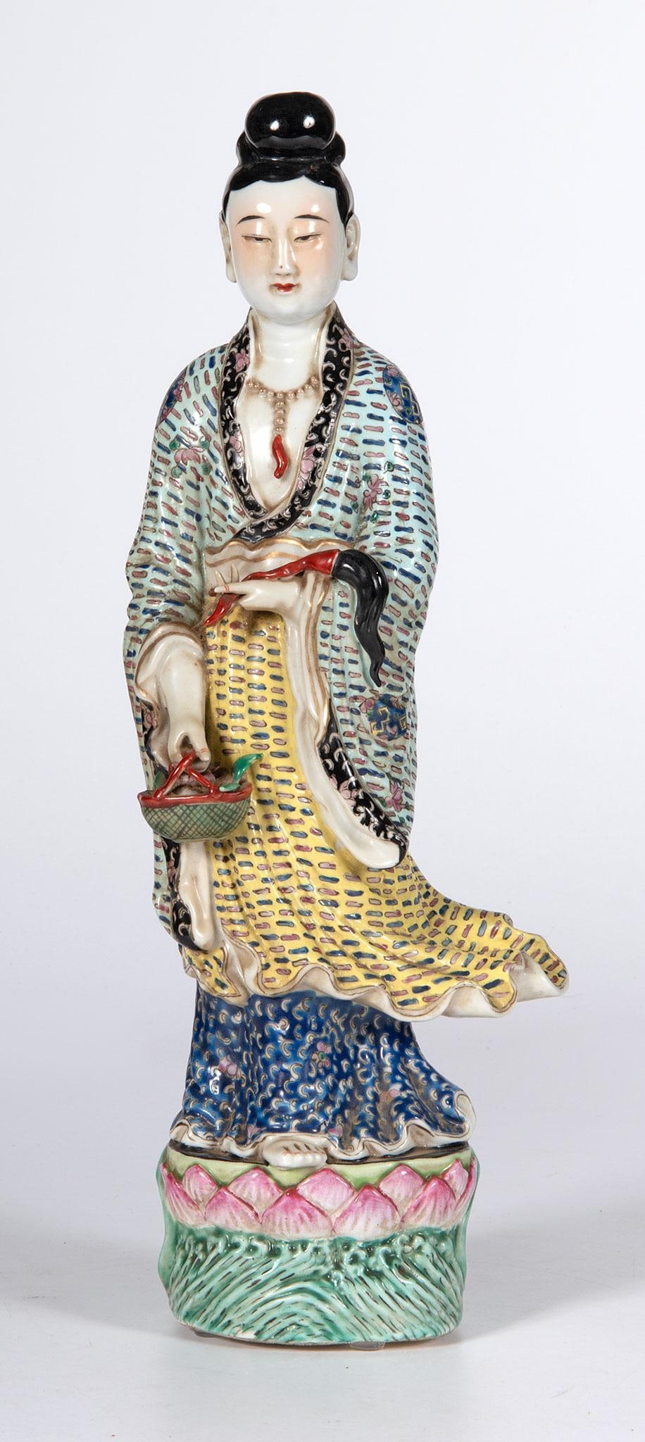 A Chinese Polychrome Decorated Kwan Yin Style Figure: Chinese, 20th century. A Chinese Republic Period polychrome decorated porcelain Kwan-Yin style sculpture, stamped China within the cast on base; ht. 15, wd. 5.5, dp. 3 inches. Overall good condition.