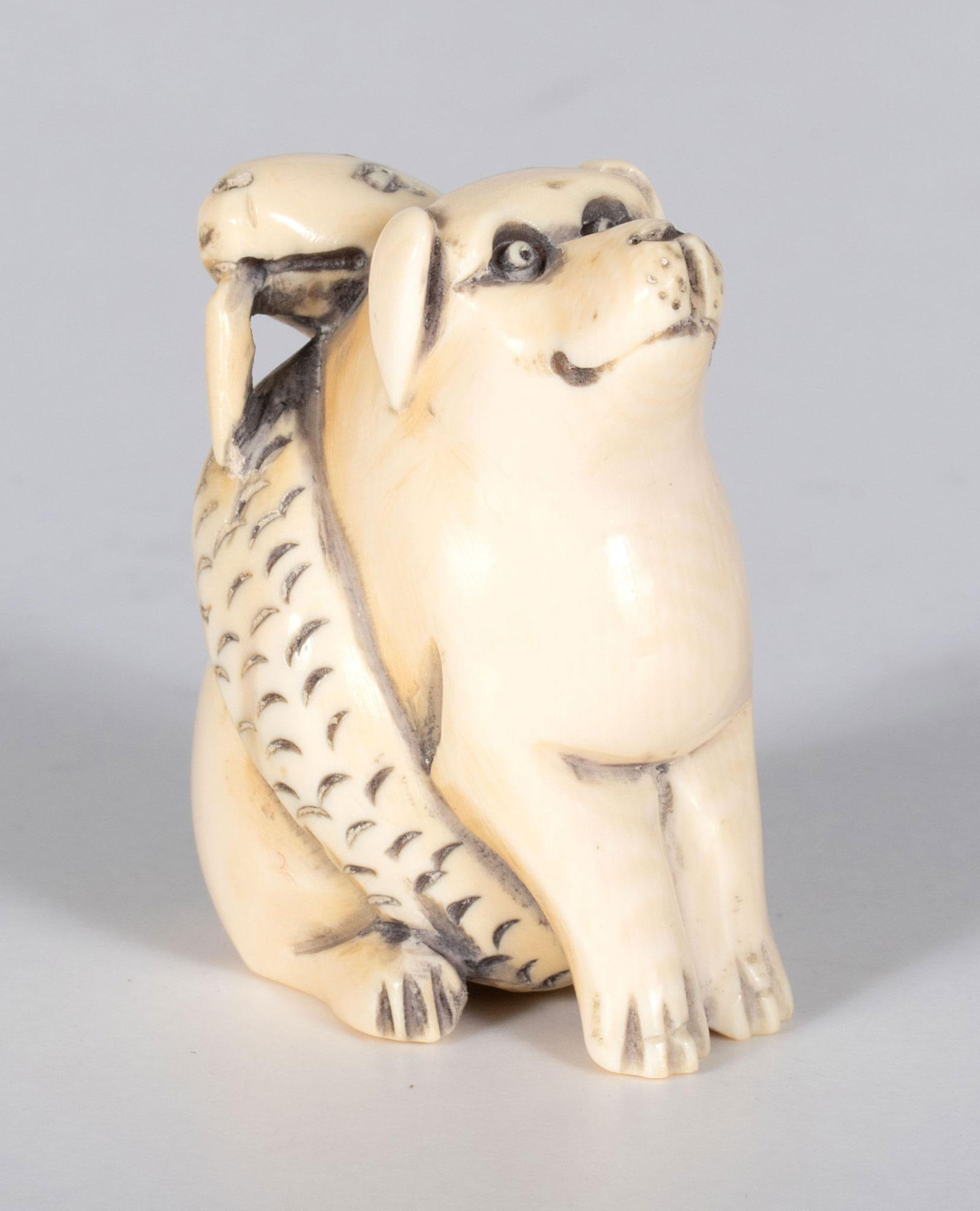 A Japanese Dog and Snake Carved Netsuke (1 of 4)