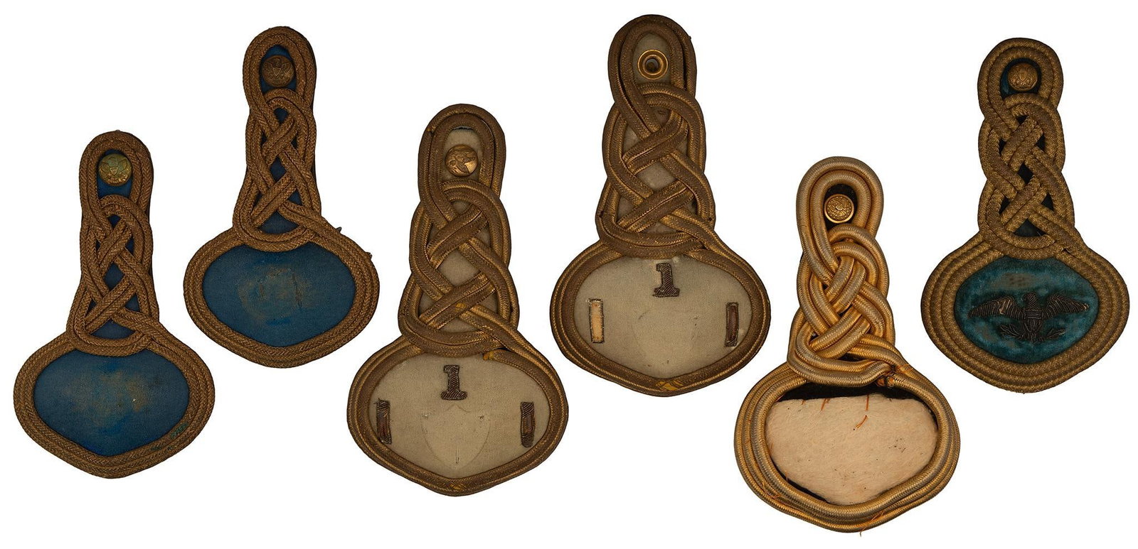 Grouping of 6 Indian Wars Epaulets: Lot includes a pair of infantry epaulets, a single officer epaulet, a single 1st Cavalry Lieutenant epaulet, two blue infantry epaulets, and a single infantry epaulet in bad to fair condition. Overall
