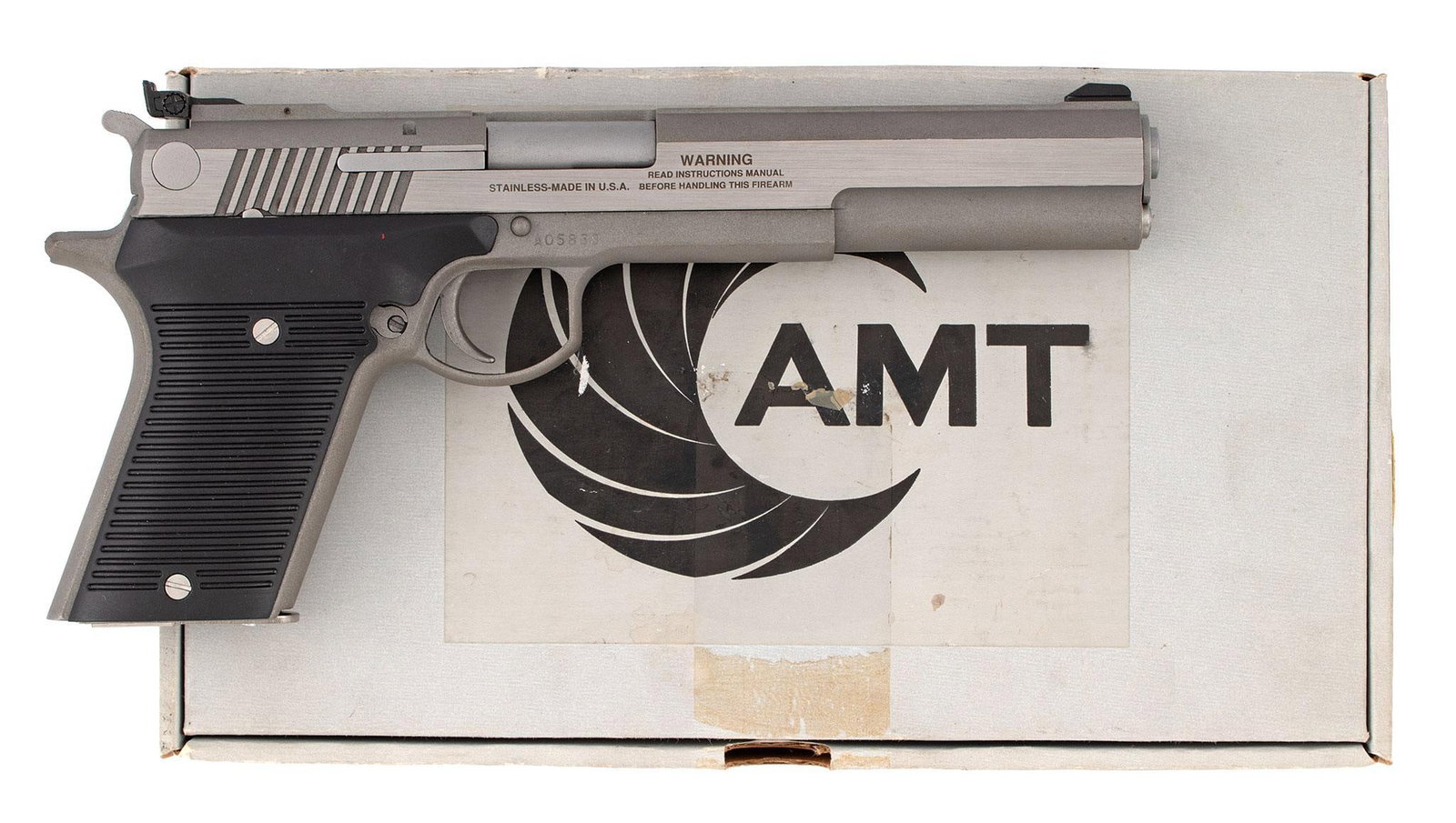 *AMT Automag III Pistol: .30 carbine caliber, 6.5", S/N AO5839, stainless steel, Made in the USA Irwindale Ca. Black groove synthetic grips. New in the box with the original hanging tags.