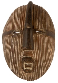 An African Carved And Painted Songye Mask