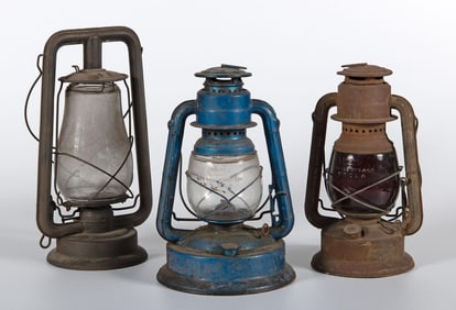 A Group of Three Dietz Kerosene Lanterns