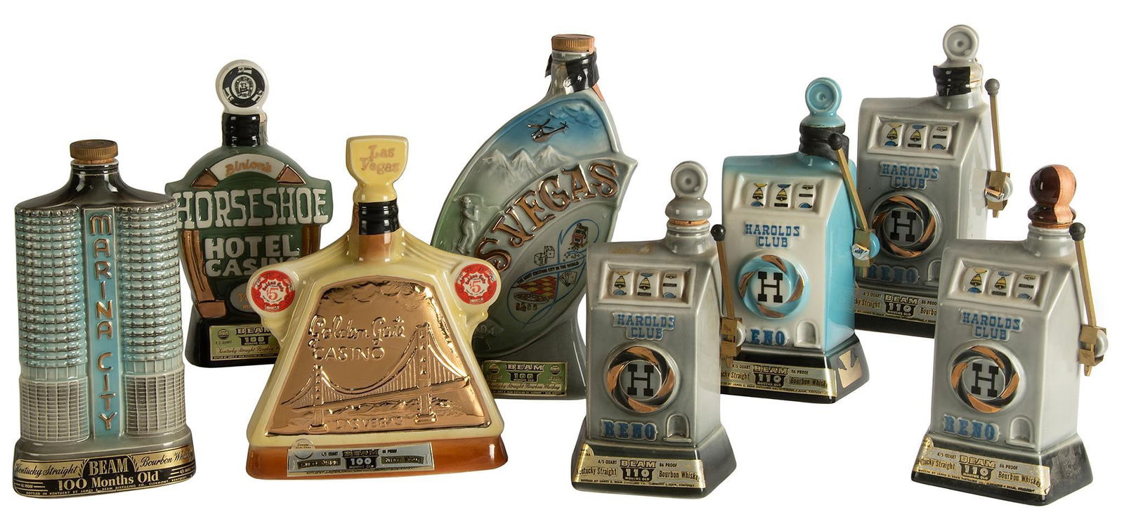 Vintage Jim Beam Casino/Hotel Related Porcelain Decanters: Lot consists of 8 vintage Jim Beam porcelain decanters, including four Harolds Club Hotel Reno, Las Vegas Nevada Hoover Dam and Lake Mead, Horseshoe Hotel Casino Las Vegas, Marina City and Golden Gate