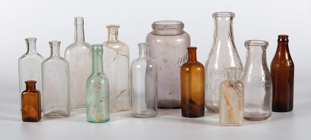A Group of 13 American Glass Bottles and Apothecary Jars