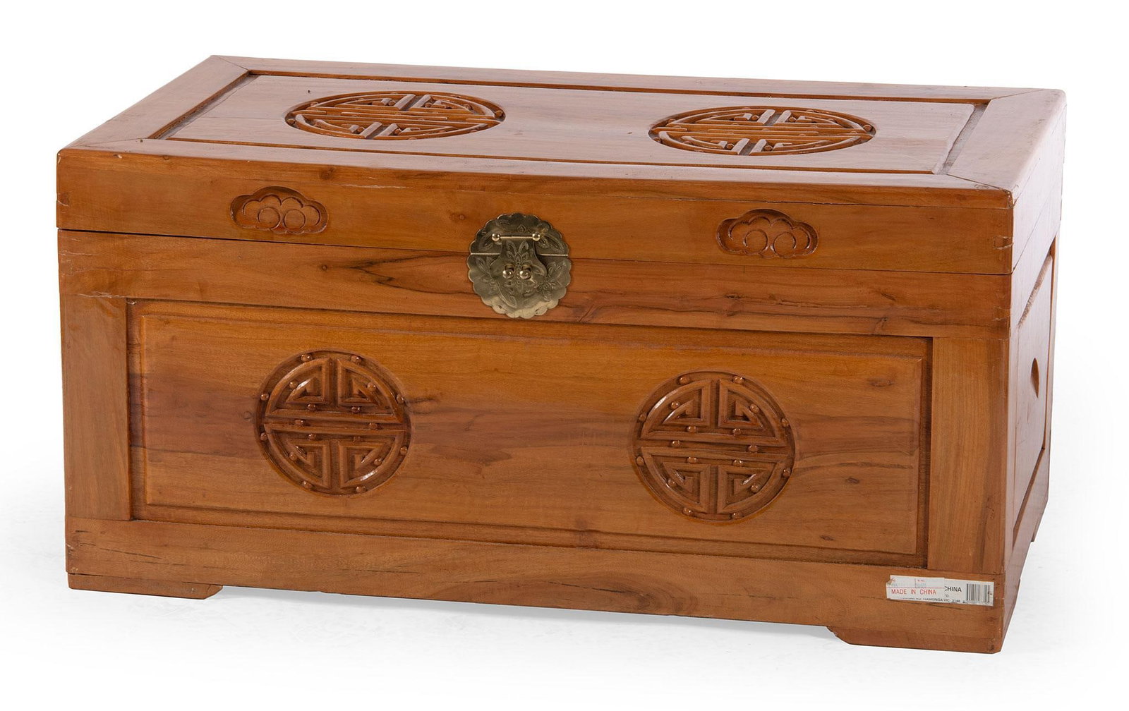 A Chinese Carved Blanket Chest in Cherry: Chinese, 20th century. A carved blanket chest in cherry, having a hinged lid with open interior, dovetailed construction rising on a shaped base; ht. 19, wd. 39.5 dp. 20.5 inches. Overall good conditi