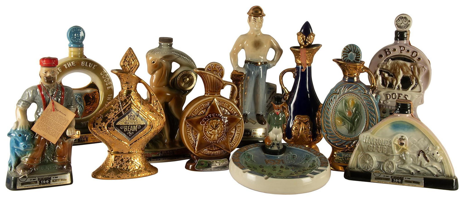 Vintage Jim Beam Various Related Porcelain Decanters: Lot consists of 11 vintage Jim Beam porcelain decanters, including Specialties Ash Tra, International Patrolium Exposition, Harolds Club, B.P.O. Does, Honorable Odder of the Blue Goose International, 