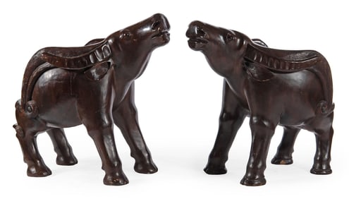 A Pair of Large Carved Water Buffalo Chairs