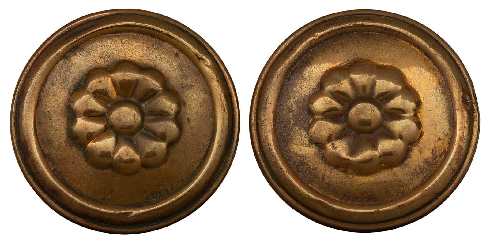 Pair of Civil War era to 1870s Brass Bridle Rosettes.: Matching pair featuring a flower motif. Some wear to reverse due to age and use. Each is 2 inches across.