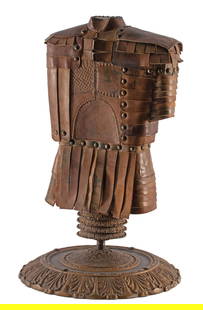 Miniature Half Suit Of Armor by Don Coppock: Leather Mounted on a stand with a floral meatal base. The base is 14.5" in diameter, and 22" high. Excellent condition.