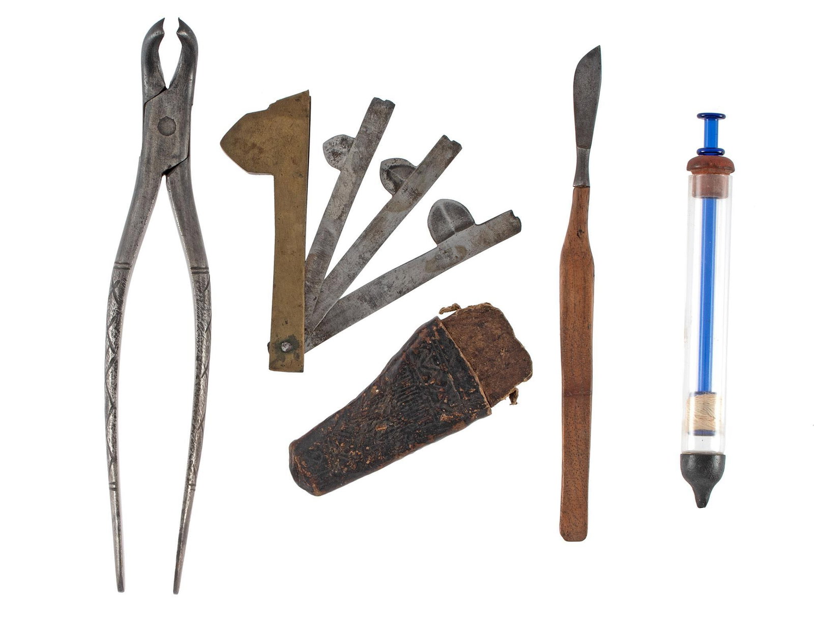 Civil War Era Surgical Equipment: Lot includes a hard rubber syringe, scalpel, tooth extractor, a glass syringe and a bladed fleam. Overall good condition.