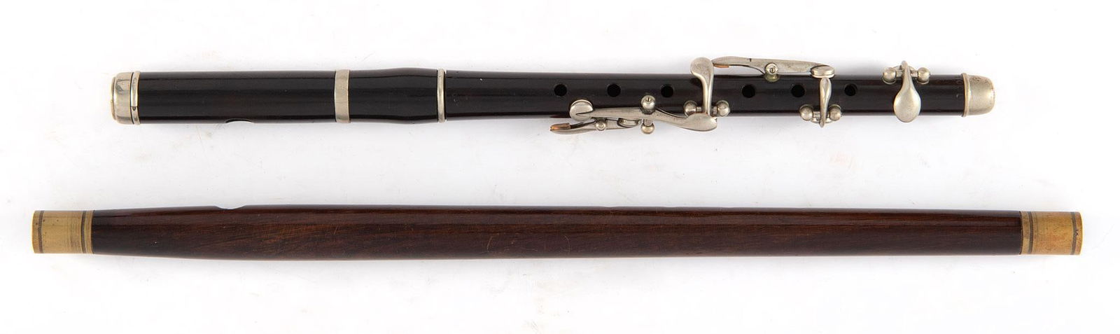 A Group of 2 Trumpets 20th Century: A group of two wooden framed trumpets with brass and metal fittings. Marked on baseGeo.Cloop 8004 on the smaller of the 2. Other is unmarked.