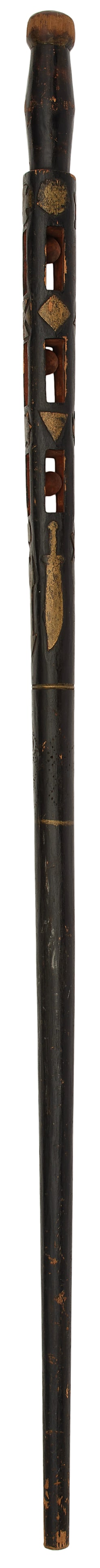 Folk Art Freemasonry Carved Whimsey Cane: Lot includes a single folk art carved and painted walking stick with ball in cage, overall painted and carved with gold decorated highlights square and compass, arrow, sword with flintlock pistol; 36.