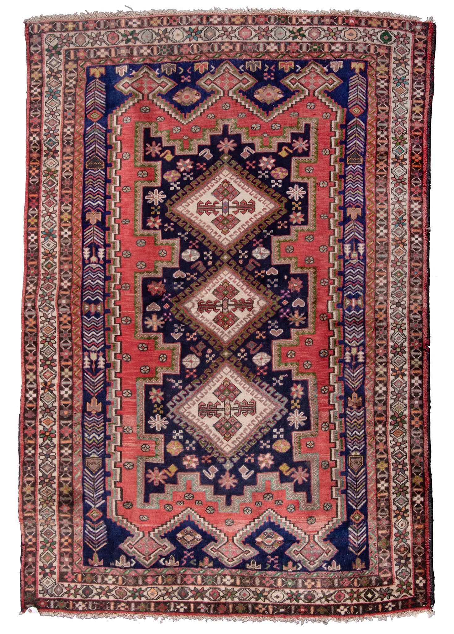 A Caucasian Area Rug: Caucasian, 20th century; 88 x 56 inches. Good overall condition.
