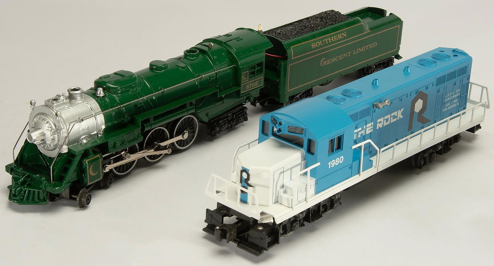Two Lionel O & 27 Gauge Engines: Lot includes a LCCA GP-20 Diesel "The Rock" #6-8068 & Southern Crescent Die-Cast Steam 4-6-4 Locomotive and Tender #6-8702. All in original boxes. Overall good condition.