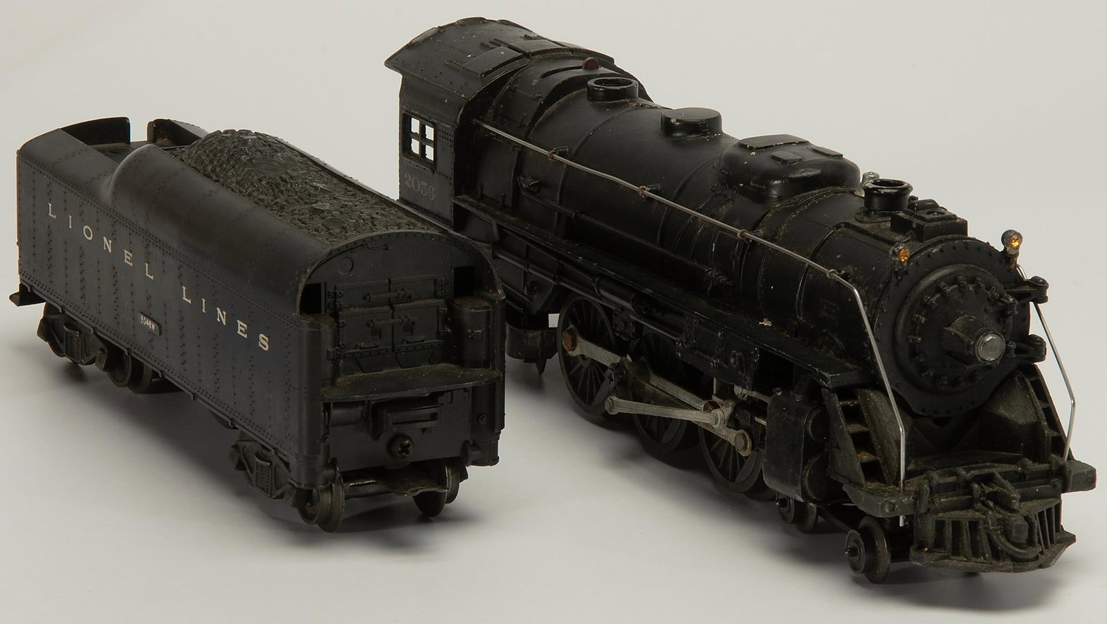 Lionel 2056 Steam Locomotive with Tender: Lionel 2056 Steam Locomotive with Tender set. Overall good condition with dust and storage grime.