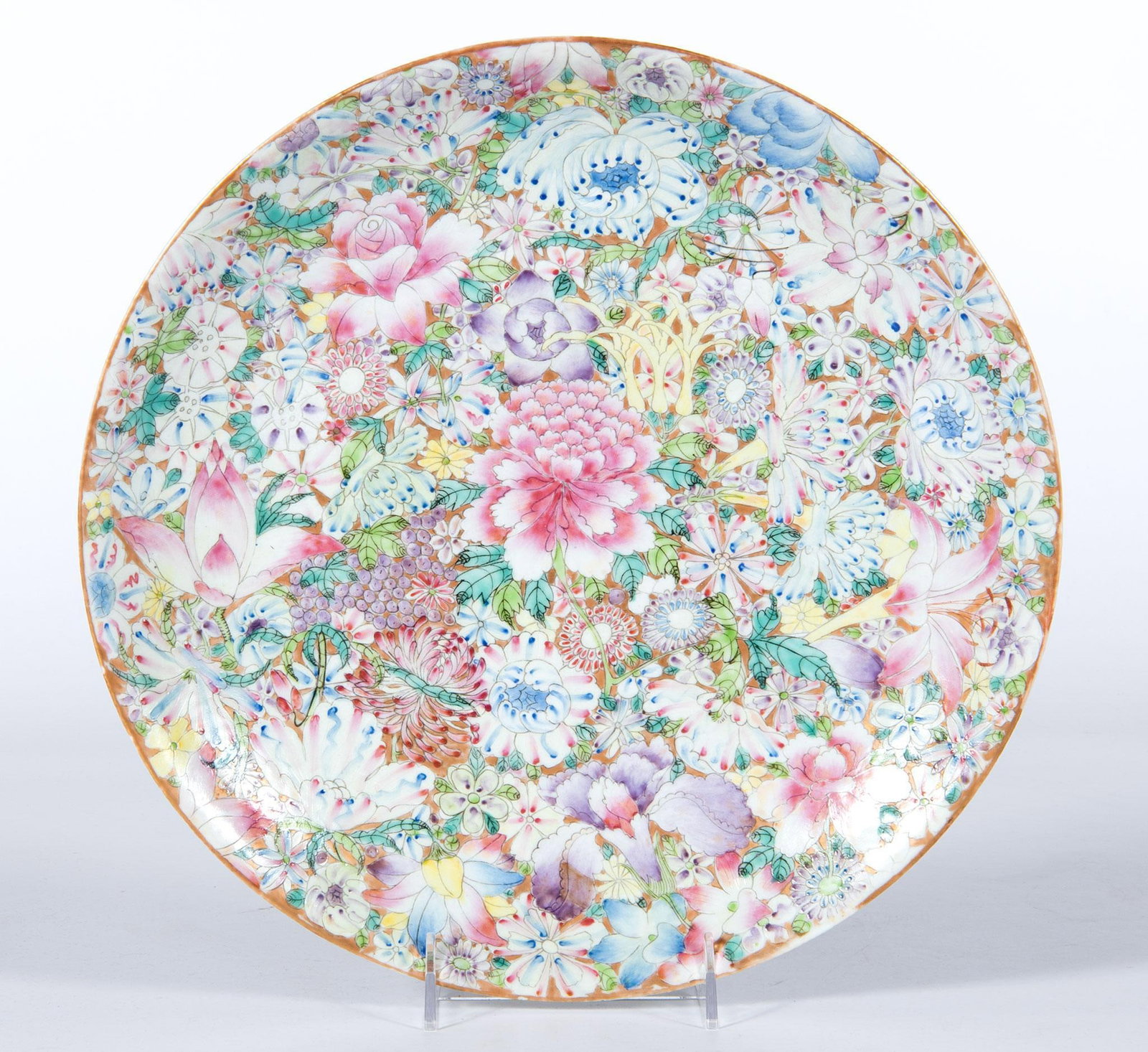 Chinese Qianlong Marked Millefiori Porcelain Charger: A Chinese Millefiori porcelain charger with overall foliate decoration, underside with hand painted iron red Qianlong markings; dia. 13 inches. Overall good condition. Very very minor aged chip and ha