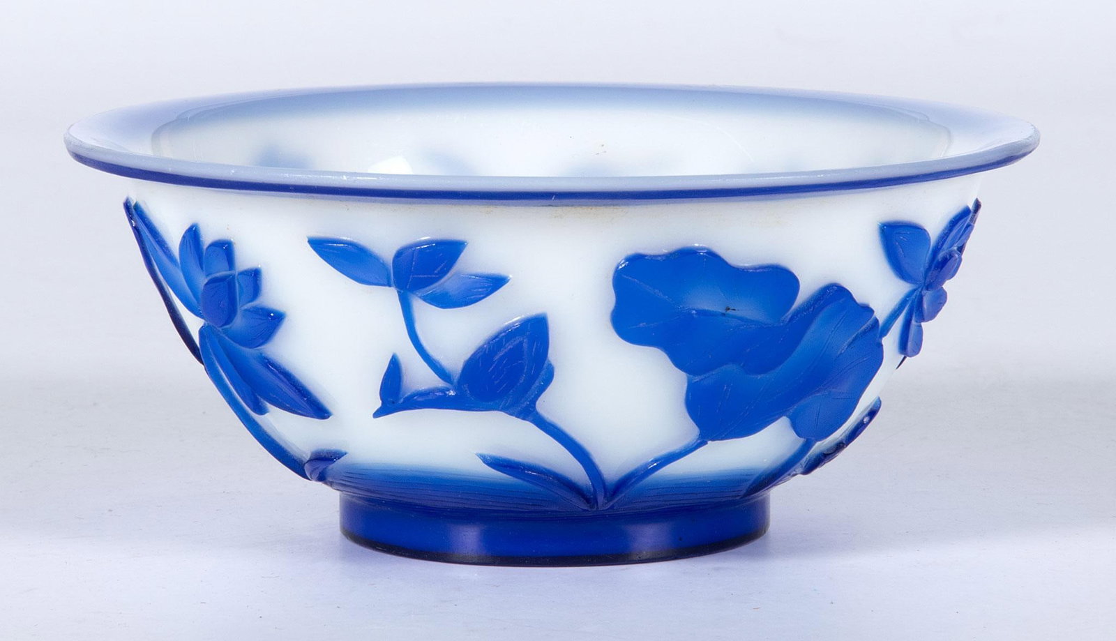A Chinese Peking Glass Bowl: Chinese, 19th century. A single blue over white Chinese peking glass bowl; ht 2.5 x dia. 6.25 inches. Overall good condition.