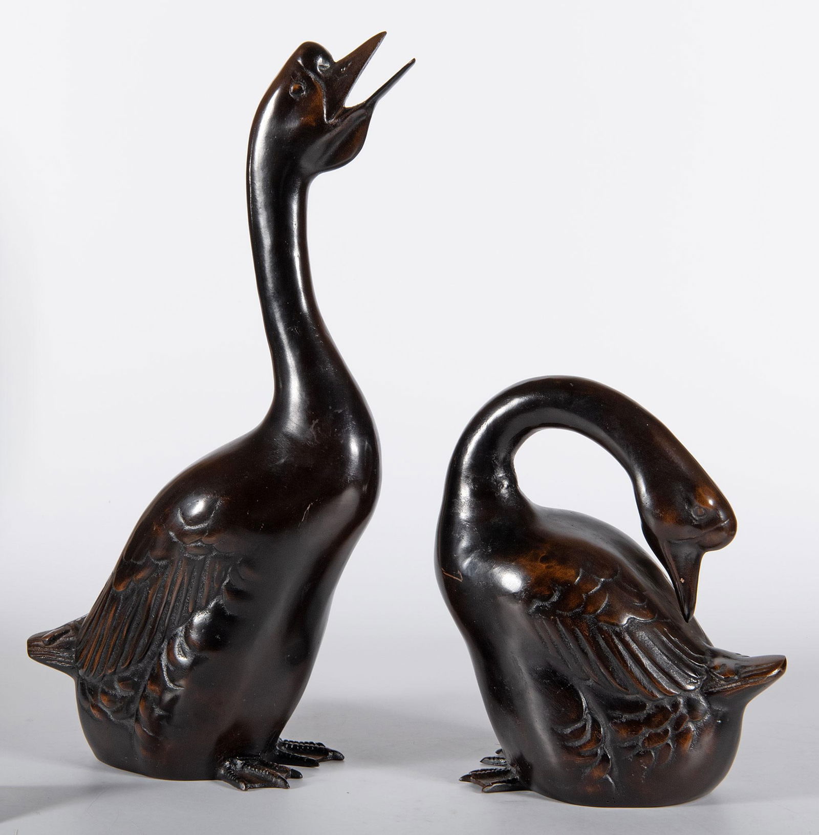 Two Japanese Bronze Geese: Japanese, 20th century. Two Japanese bronze geese; largest ht. 23, wd. 16, dp. 6 inches. Overall good condition.