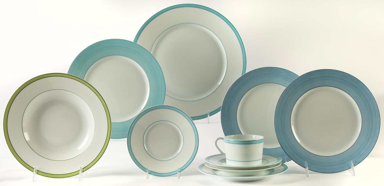 A Grouping of Raynaud Limoges Dinnerware Pieces: French, 20th century. A grouping of Raynaud Limoges porcelain dinnerware pieces in the Tropic and Pareo patterns. Tropic pattern includes a teacup and saucer, 2 bread and butter, single salad plate, a
