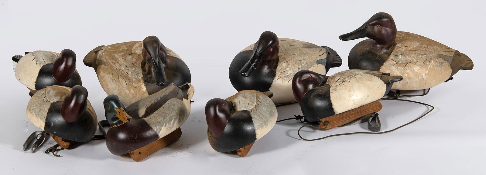 8 Painted Poly-Foam Duck Decoys: Lot includes 8 painted poly-foam duck decoys with no makers mark, each feather painted; largest ht. 12, wd. 18, dp. 10 inches. 3 of the decoys by Mueller Overall good condition.