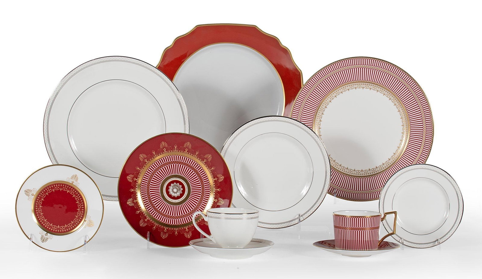 Grouping of Iron Red and Gold Dinnerwares: Lot consist of 10 pieces of porcelain dinnerwares from makers Wedgewood and Bentley, and Waterford. Includes Waterford "Padova" pattern and Wedgewood "Anthemion Ruby" pattern; largest dia. 12 inches. 