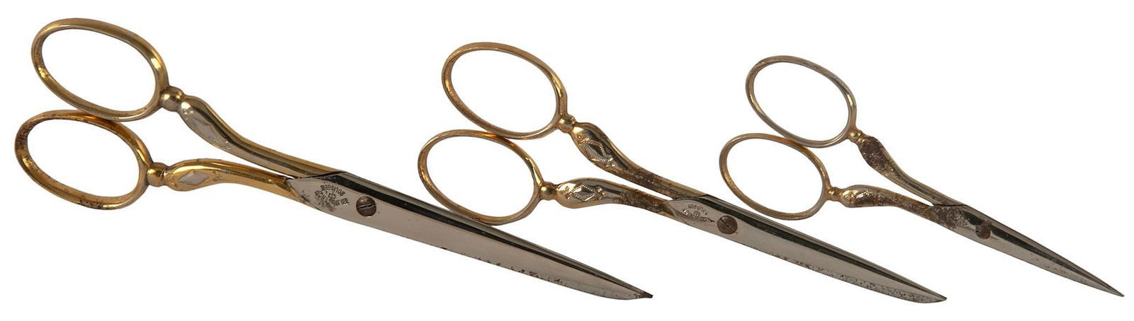 Set of Ed Wusthof Solingen Gold Plated Scissors: German, 20th century. A set of three various sized gold plated scissors by Ed Wusthof; largest 5.5 inches. Overall good condition. Minor oxidation throughout.