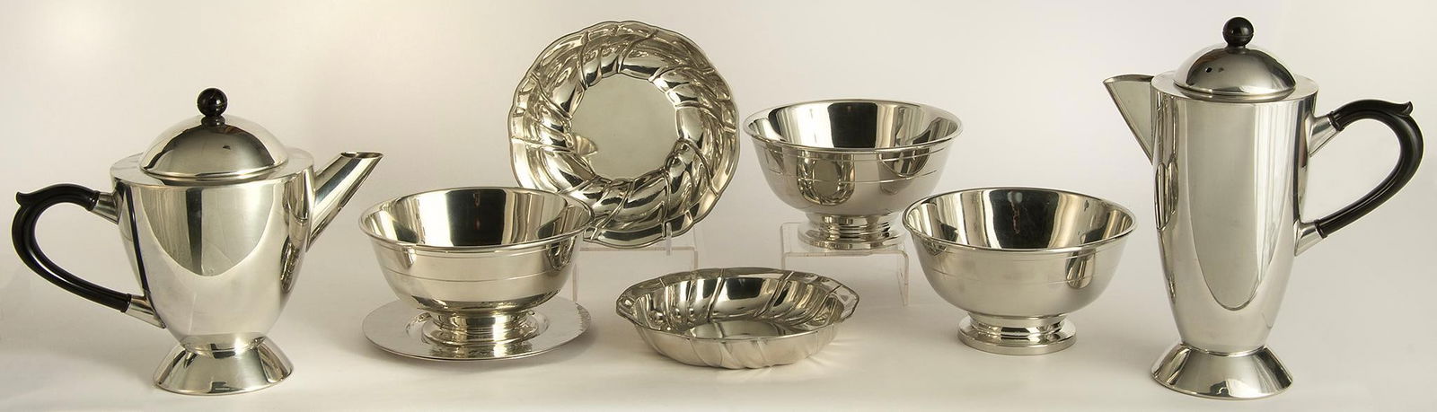 Grouping of Pewter Tablewares: Lot of 20th century pewter tablewares by various makers, including two coffee pots, two wine coasters, and 5 various sized bowls, made by Old Newbury Pewter and DH Pewter England; largest ht. 9, wd. 8