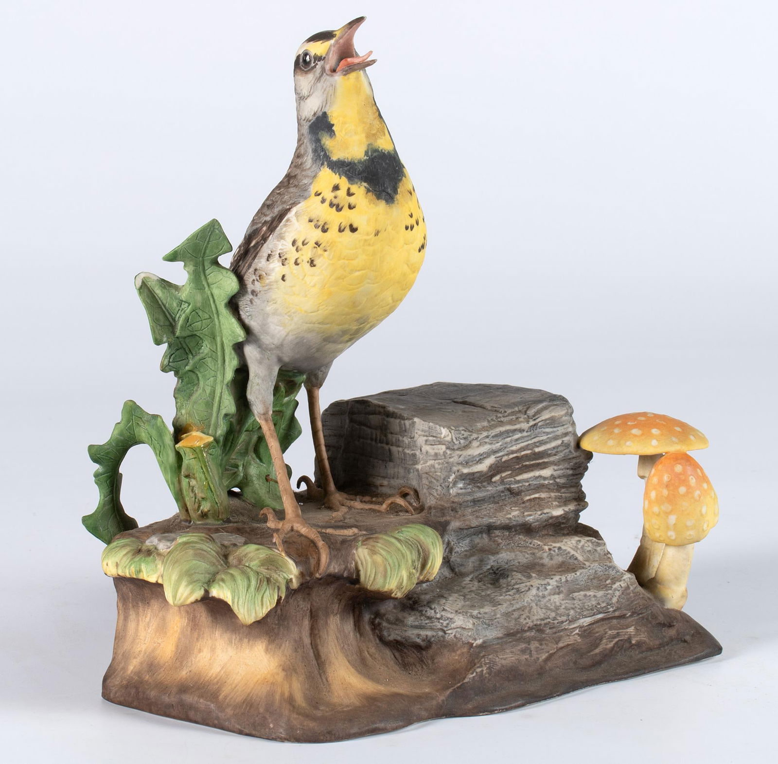 A Boehm Meadowlark Porcelain Sculpture: American, 20th century. An ornithology bisque porcelain sculpture of a "Meadowlark" by Boehm, limited edition; ht. 8.5, wd. 7, dp. 5.5 inches. Overall good condition. Minor loss of foliage left of bir