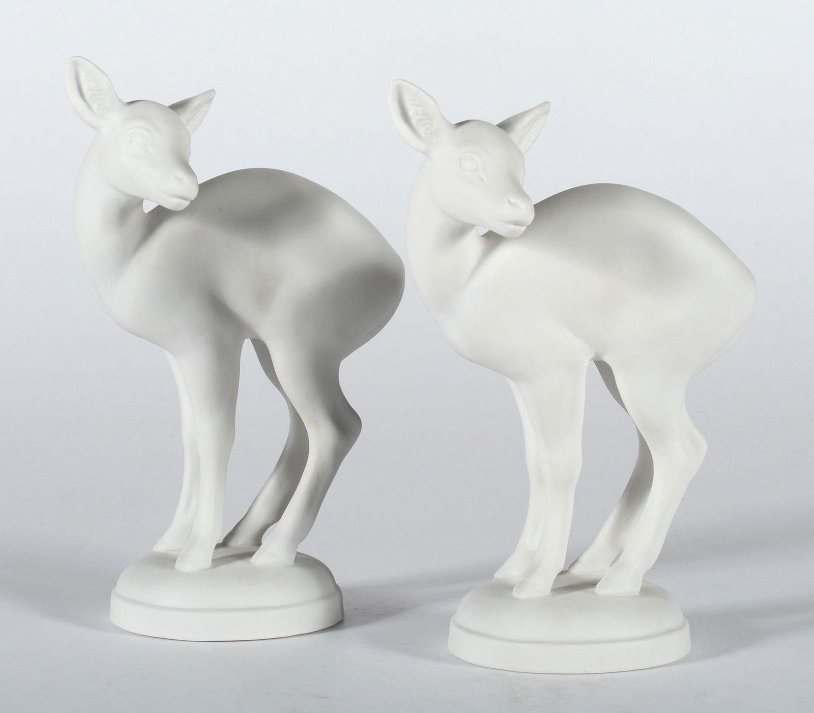 Pair of Royal Copenhagen Bisque Fawns: Lot includes two Royal Copenhagen bisque porcelain fawns #929 hallmarked bases; ht. 7.5 x wd. 5 inches. Overall good condition in original boxes.