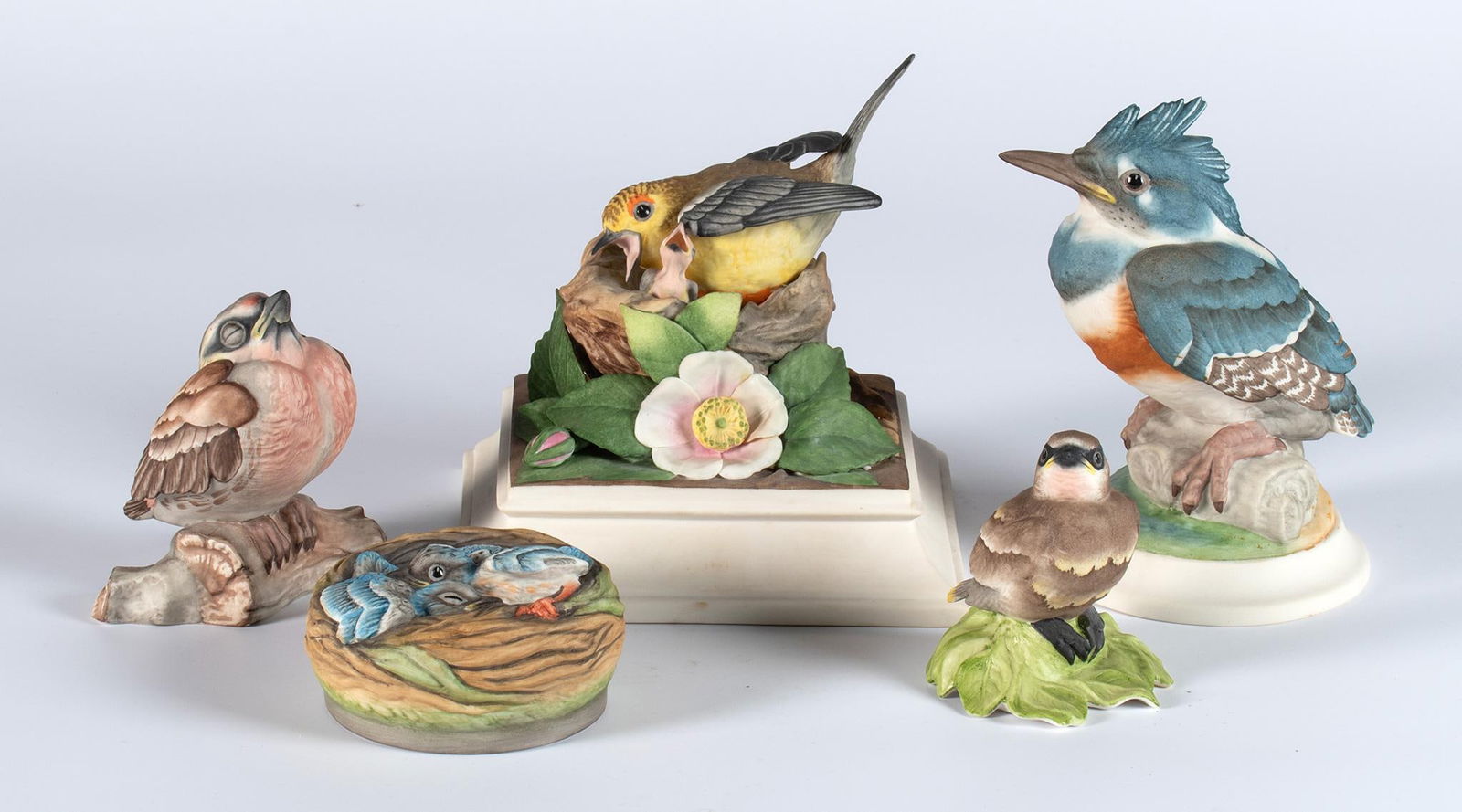 A Group of Boehm Ornithology Porcelain Sculptures: American, 20th century. A group of 5 bisque porcelain sculptures by Boehm, lot includes a Fledging Kingfisher #449, Fledging Red Poll #495, Baby Buntings #400-10, Cedar Waxwing #432, and Prothonotary