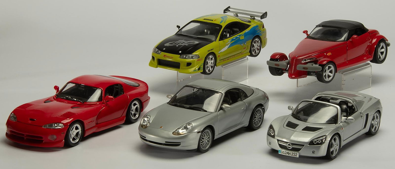 Vintage die cast cars: Group of 5 die cast cars of various brands including: Anson (Plymouth Prowler), Maisto (Dodge Viper GTS), Racing Champions (1995 Eclipse), Hot Wheels (Porchse 911), Maisto (Opel speedster)